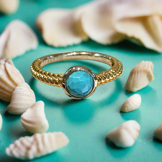 Load image into Gallery viewer, Photo of Turquoise Bezel Rope Ring in a decorative scene, designed by , available at Plumb Gold &amp;amp; Plumb Silver
