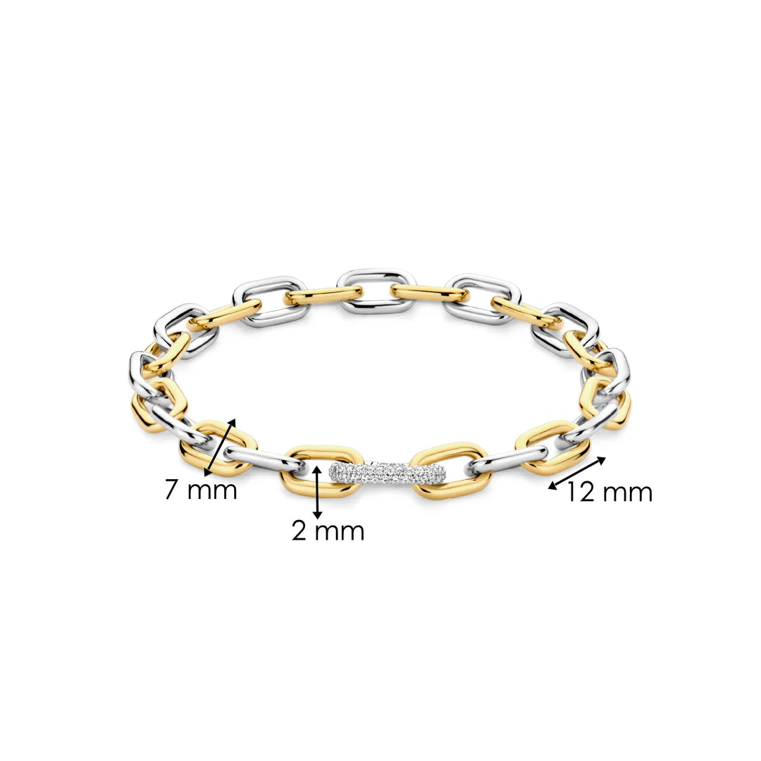 Photo of Two Tone Cable Bracelet in a decorative scene, designed by -, available at Plumb Gold & Plumb Silver