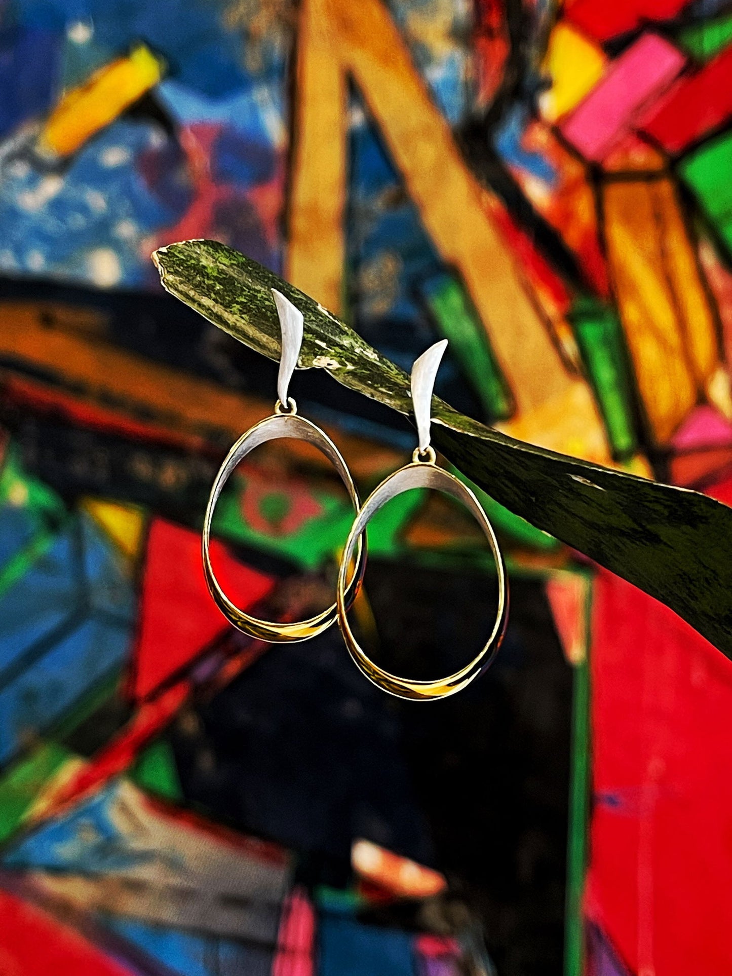 Photo of "Venice" Earrings in a decorative scene, designed by , available at Plumb Gold & Plumb Silver