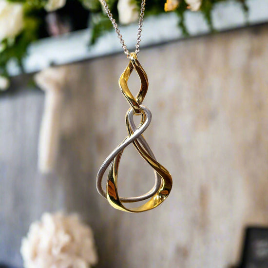 Photo of “Venice” Two Tone Pendant in a decorative scene, designed by , available at Plumb Gold & Plumb Silver