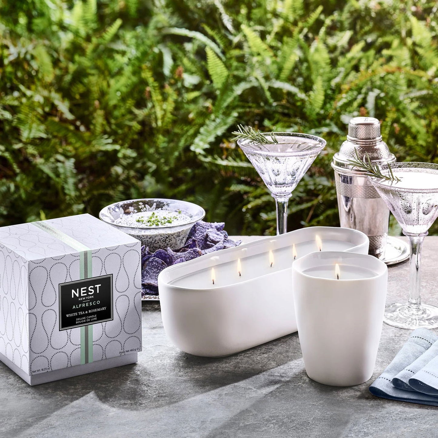 Photo of White Tea & Rosemary Alfresco in a decorative scene, designed by , available at Plumb Gold & Plumb Silver