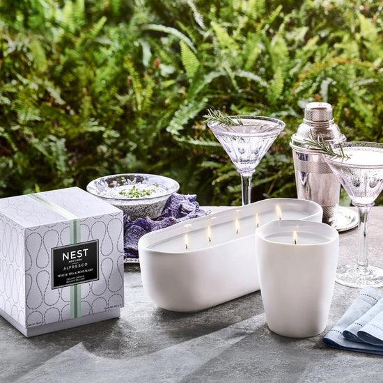 Photo of White Tea & Rosemary Alfresco in a decorative scene, designed by , available at Plumb Gold & Plumb Silver