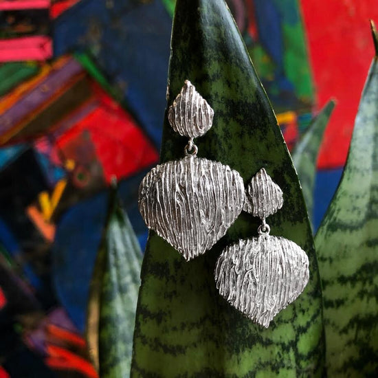 Photo of "Wild Rodio" Earring in a decorative scene, designed by , available at Plumb Gold & Plumb Silver
