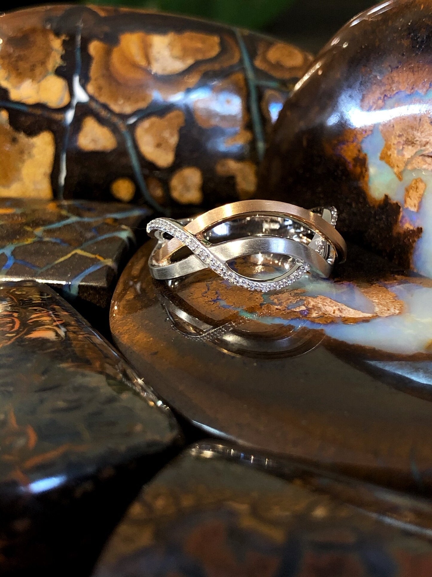 Photo of Woven Twist Diamond Ring in a decorative scene, designed by , available at Plumb Gold & Plumb Silver