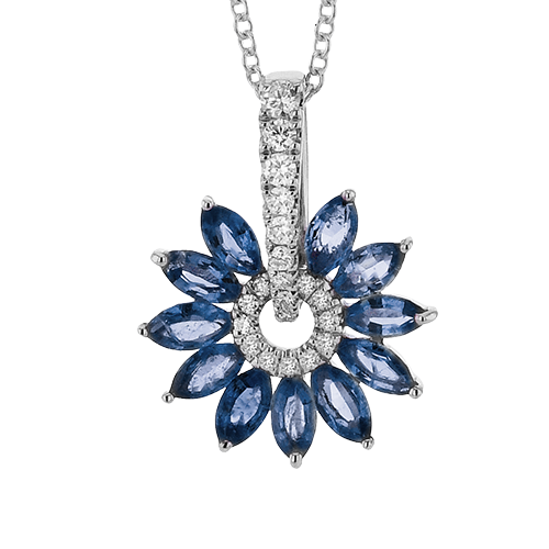 Photo of Zeghani Sapphire and Diamond "Burst" Necklace in a decorative scene, designed by , available at Plumb Gold & Plumb Silver
