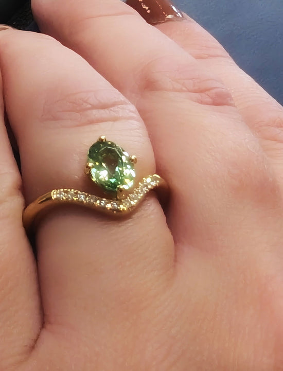 Photo of Zoma Color Mint Garnet and Diamond Ring in a decorative scene, designed by , available at Plumb Gold & Plumb Silver