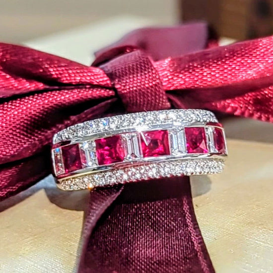 Photo of Zoma Color Ruby and Diamond Band in a decorative scene, designed by , available at Plumb Gold & Plumb Silver