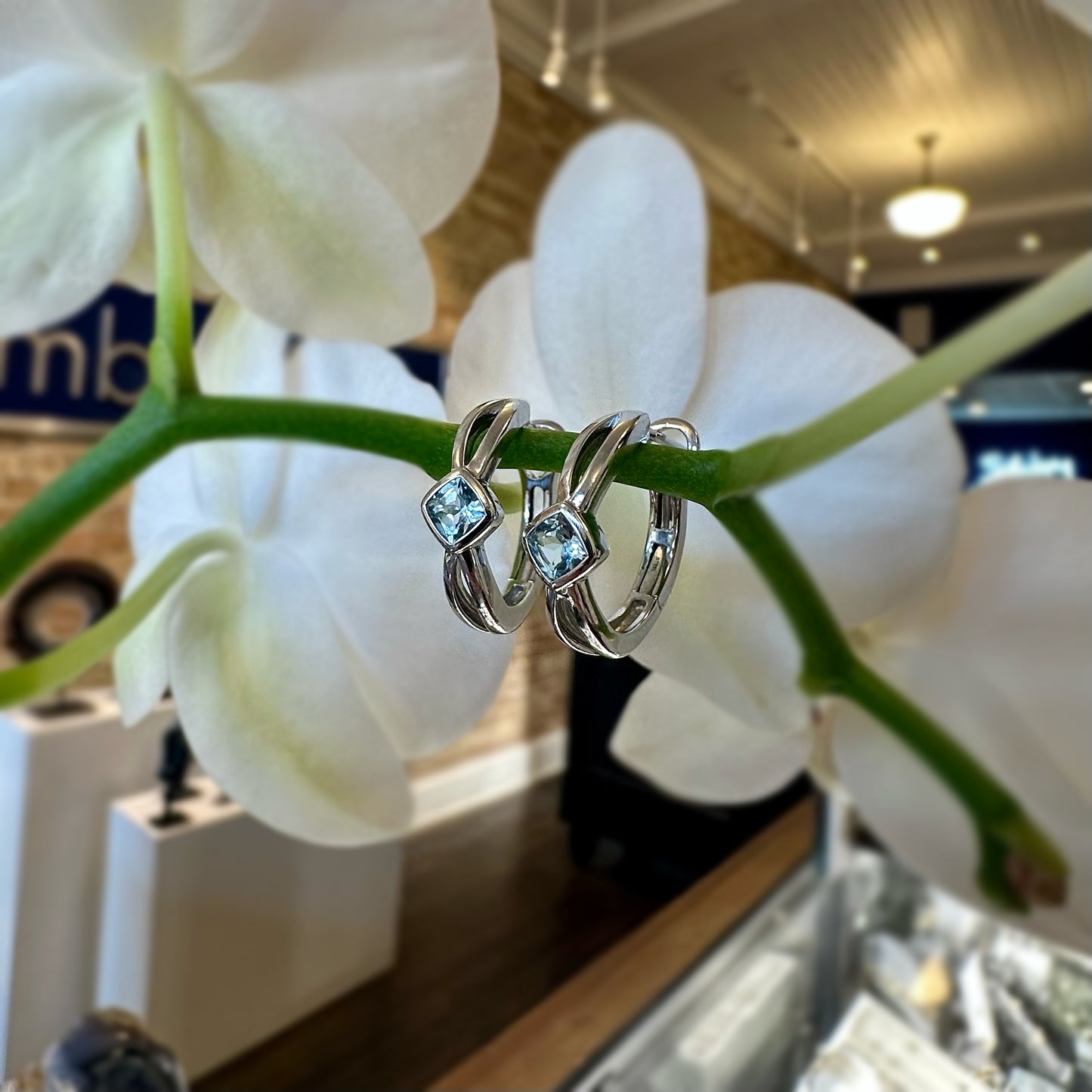 Blue Topaz Huggies