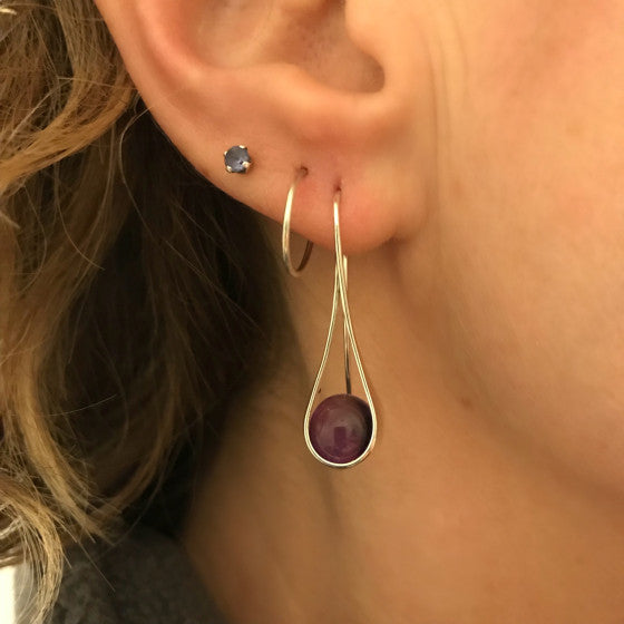 Earring on a female model, available at plumb silver jewelry store