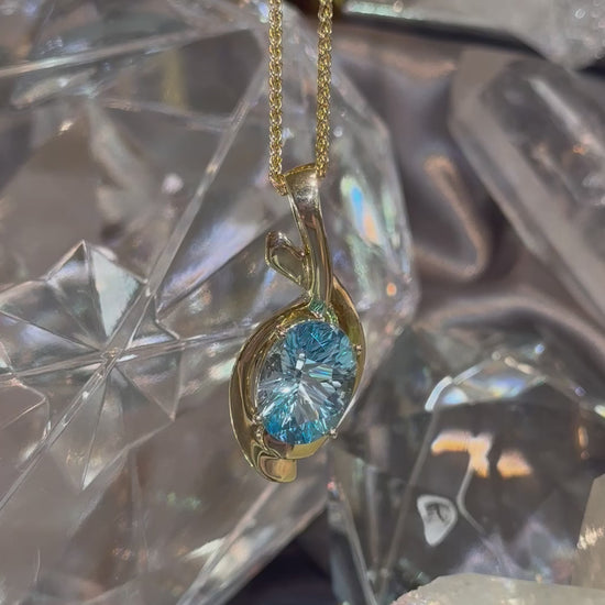 Load and play video in Gallery viewer, Blue Topaz Swoop Pendant
